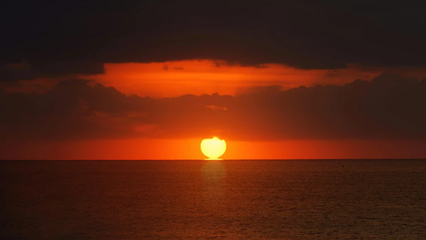 the sun is setting over a large body of water, a picture, pexels contest winner, romanticism, digital yellow red sun, aruba, horizon, no cropping