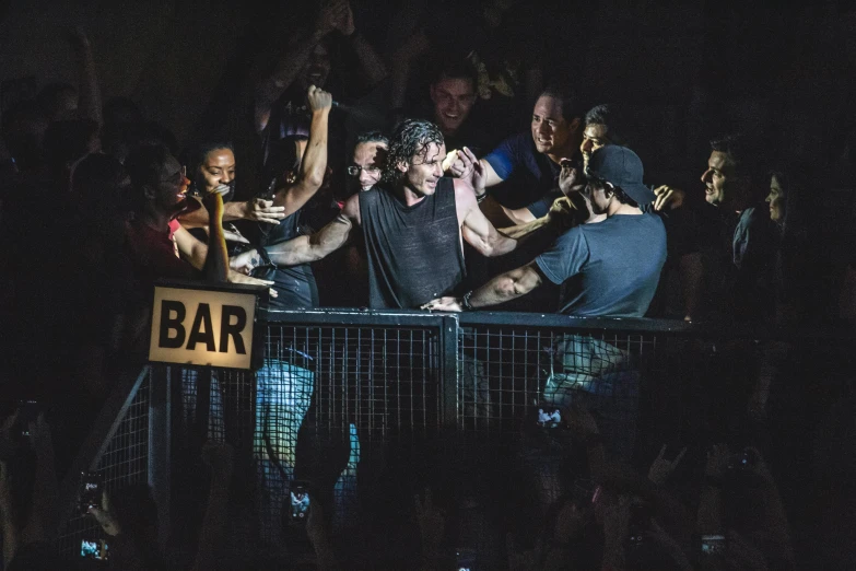 a group of people standing on top of a stage, trent reznor, behind bars, ben askren, concert photo