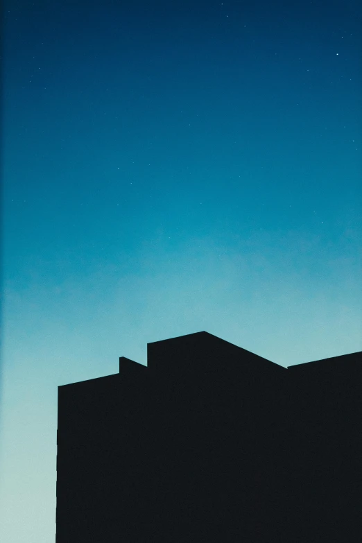 the silhouette of a building against a blue sky, by Russell Chatham, postminimalism, medium format. soft light, kano)