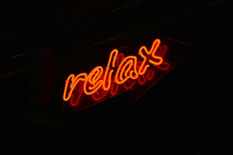 a neon sign is lit up in the dark, a picture, pexels, sitting relax and happy, red on black, relaxing, reflexions