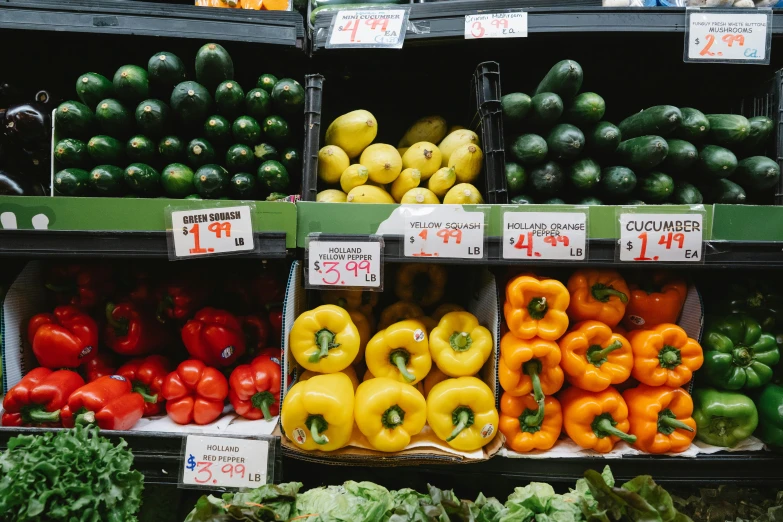 a display in a grocery store filled with lots of vegetables, a photo, by Nicolette Macnamara, pexels, scarlet and yellow scheme, 2 5 6 x 2 5 6 pixels, sydney hanson, in a row