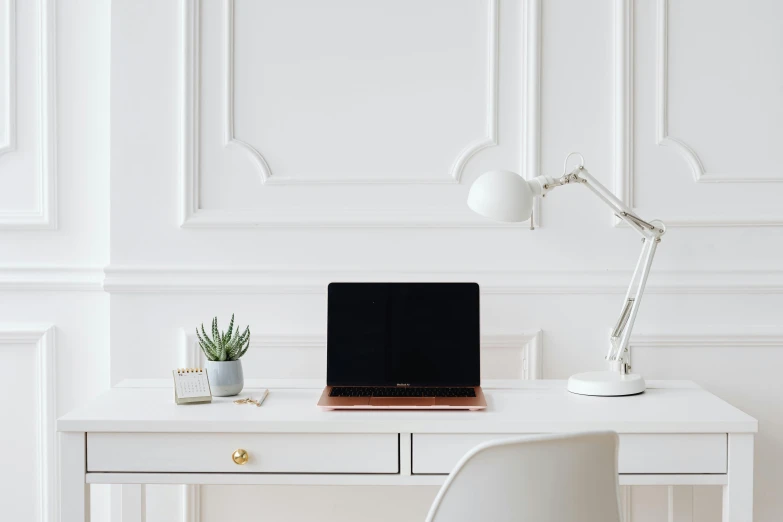 a laptop computer sitting on top of a white desk, trending on pexels, ivory and copper, smooth panelling, in white room, white