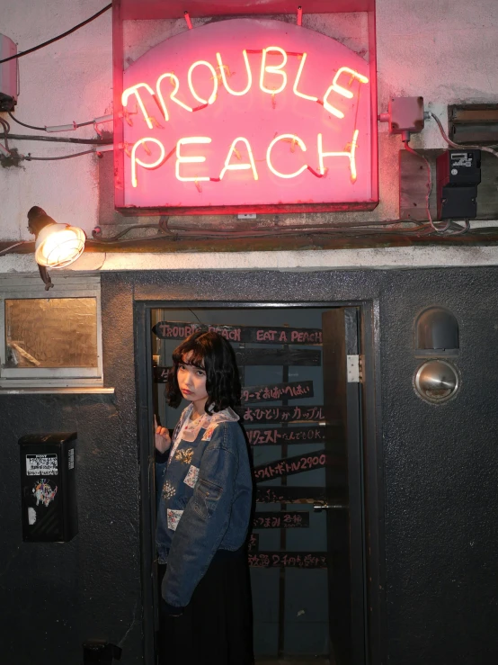 a woman standing in a doorway in front of a neon sign, an album cover, tumblr, a human-like juicy peach, grunge aesthetic!!! (, struggle, peach