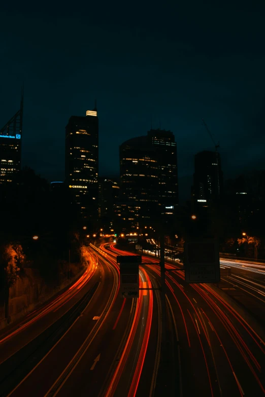 a city street filled with lots of traffic at night, an album cover, unsplash contest winner, australia, sinuous, late morning, skyline