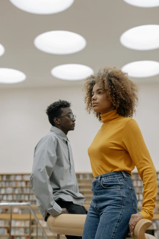 a man and a woman sitting on a bench in a library, trending on pexels, black arts movement, wearing turtleneck, as she looks up at the ceiling, curly haired, standing confidently