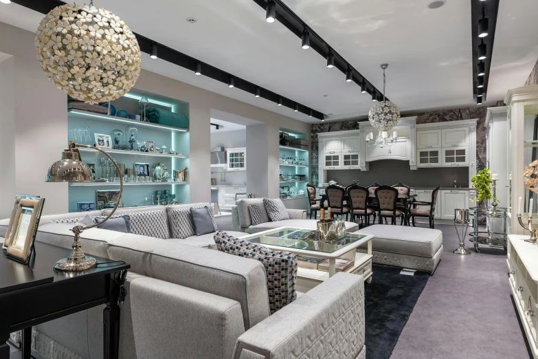 a living room filled with furniture and a chandelier, trending on cg society, luxury bespoke kitchen design, white and teal metallic accents, photo for a store, indoor soft lighting