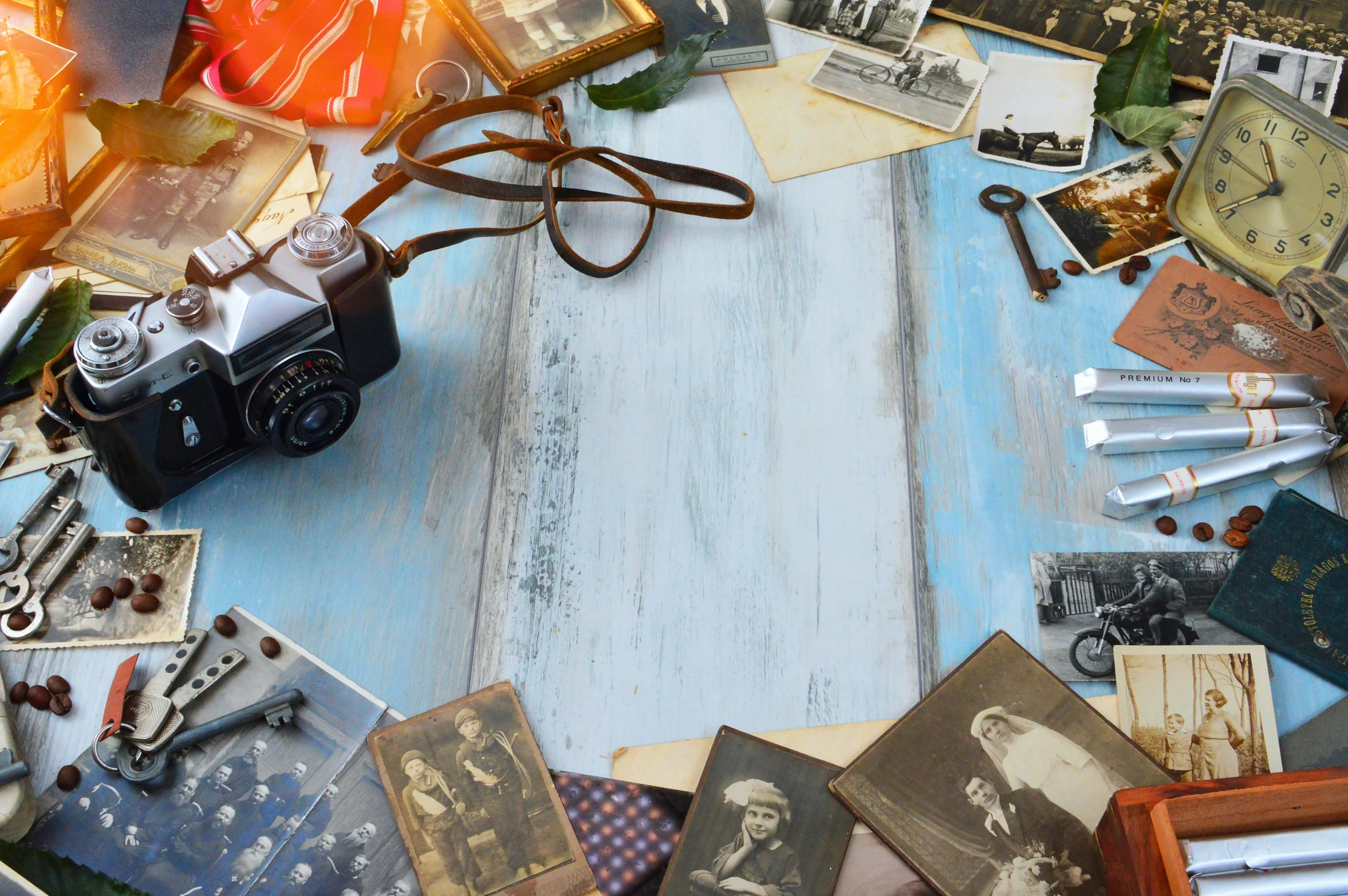 a camera sitting on top of a wooden table, a picture, by Sylvia Wishart, pexels contest winner, assemblage, family photo, knolling, historic moment, nongraphic