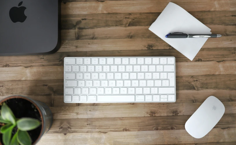 a computer keyboard sitting on top of a wooden desk, trending on pexels, white finish, high - angle view, thumbnail, background image