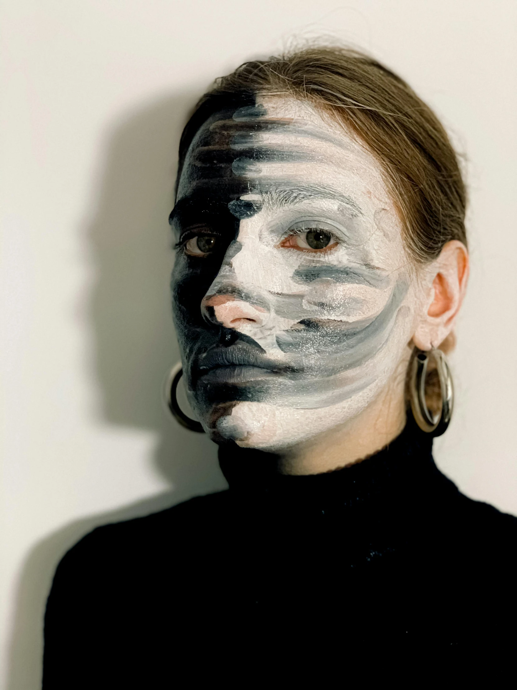 a woman with white paint on her face, inspired by Anna Füssli, reddit, photography of charline von heyl, stripe over eye, grey skin, profile image