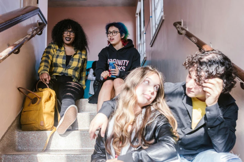 a group of people sitting on a set of stairs, pexels contest winner, antipodeans, justina blakeney, high school girls, with pop punk style, avatar image