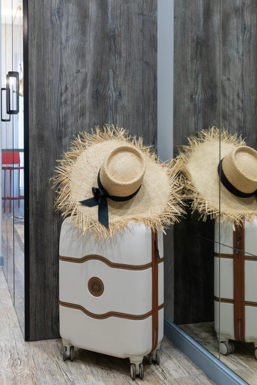 a couple of suitcases sitting on top of a hard wood floor, inspired by Tomàs Barceló, wearing straw hat, mirror hallways, locker room, detail shot