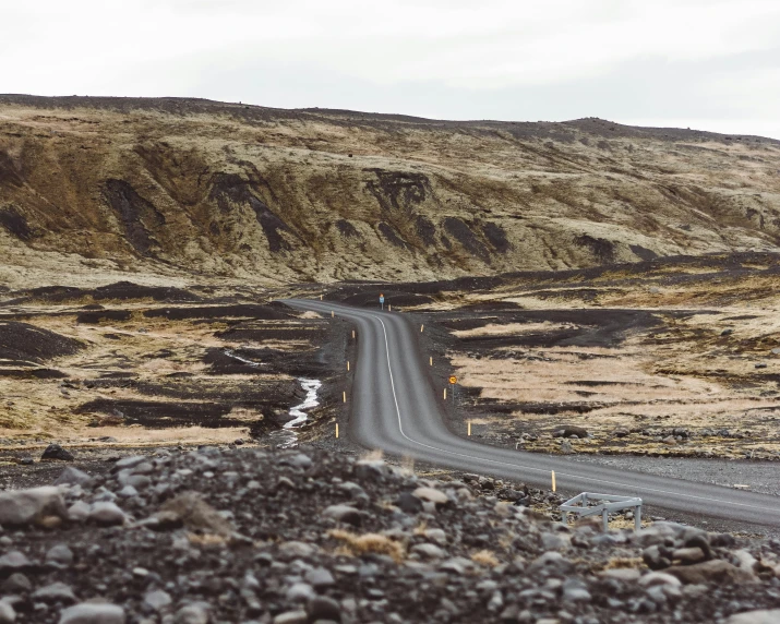 there is a car that is driving down the road, an album cover, by Hallsteinn Sigurðsson, pexels contest winner, hurufiyya, erosion algorithm landscape, mining, background image, thumbnail