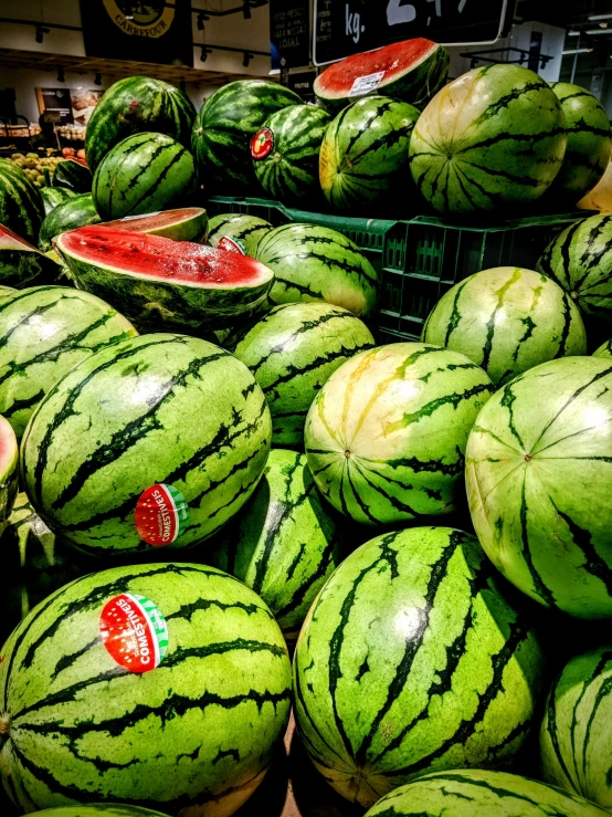 a bunch of watermelons stacked on top of each other, by Tom Wänerstrand, pexels, hyperrealism, stood in a supermarket, 🐿🍸🍋