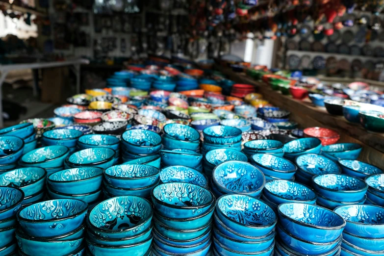 a bunch of blue bowls sitting on top of a table, lots of shops, finely painted, turqouise, thumbnail