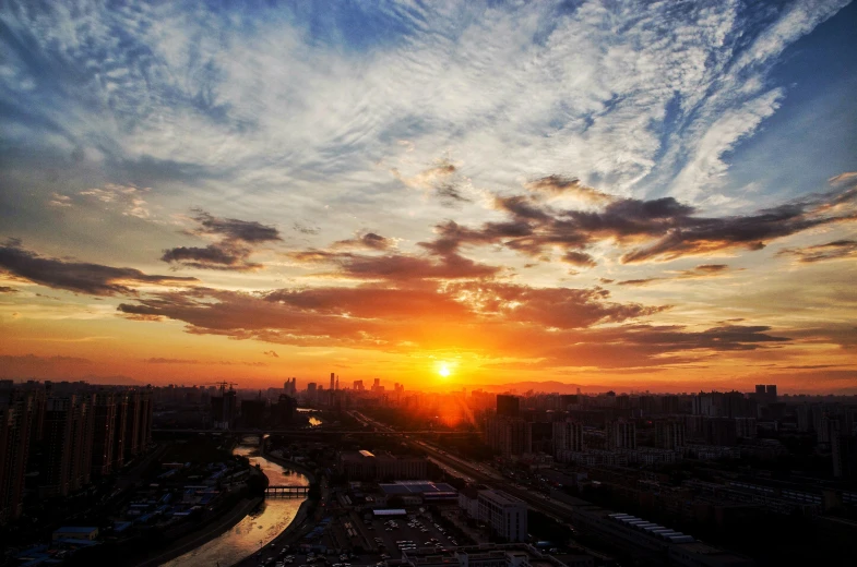 a view of the sun setting over a city, pexels contest winner, baotou china, fan favorite, moscow, shot with iphone 1 0