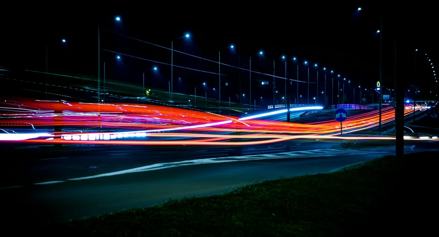 a city street filled with lots of traffic at night, a picture, by Thomas Häfner, pexels contest winner, lightpainting motion blur, highway, multicoloured, tail lights