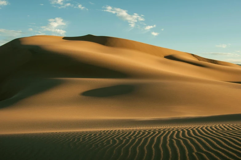 sand dunes in the desert under a blue sky, unsplash contest winner, chile, late afternoon light, background image, songlines