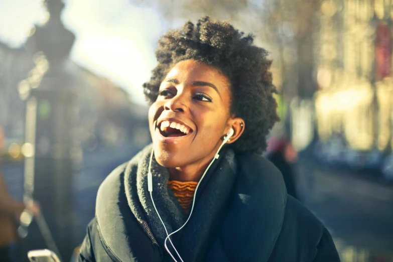 a close up of a person with headphones on, trending on pexels, she expressing joy, avatar image, black, instagram photo