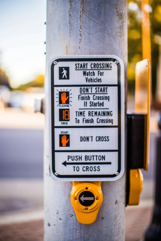 a close up of a street sign on a pole, by Matt Cavotta, reddit, happening, cruise control, crosswalk, start, crosses