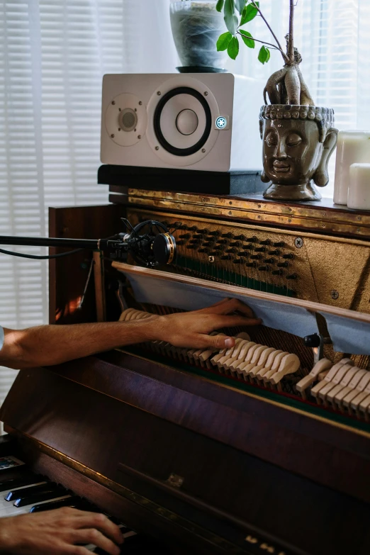 a close up of a person playing a piano, jukebox, inside a grand studio, andrew thomas huang, studio room