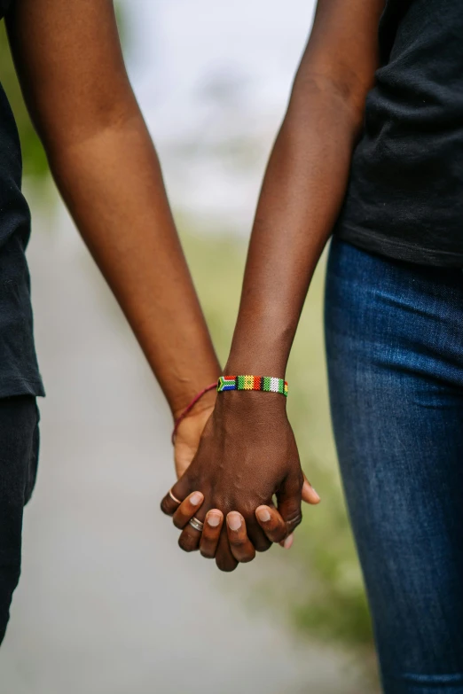 a close up of two people holding hands, by Lily Delissa Joseph, coloured photo, pride, black, 15081959 21121991 01012000 4k