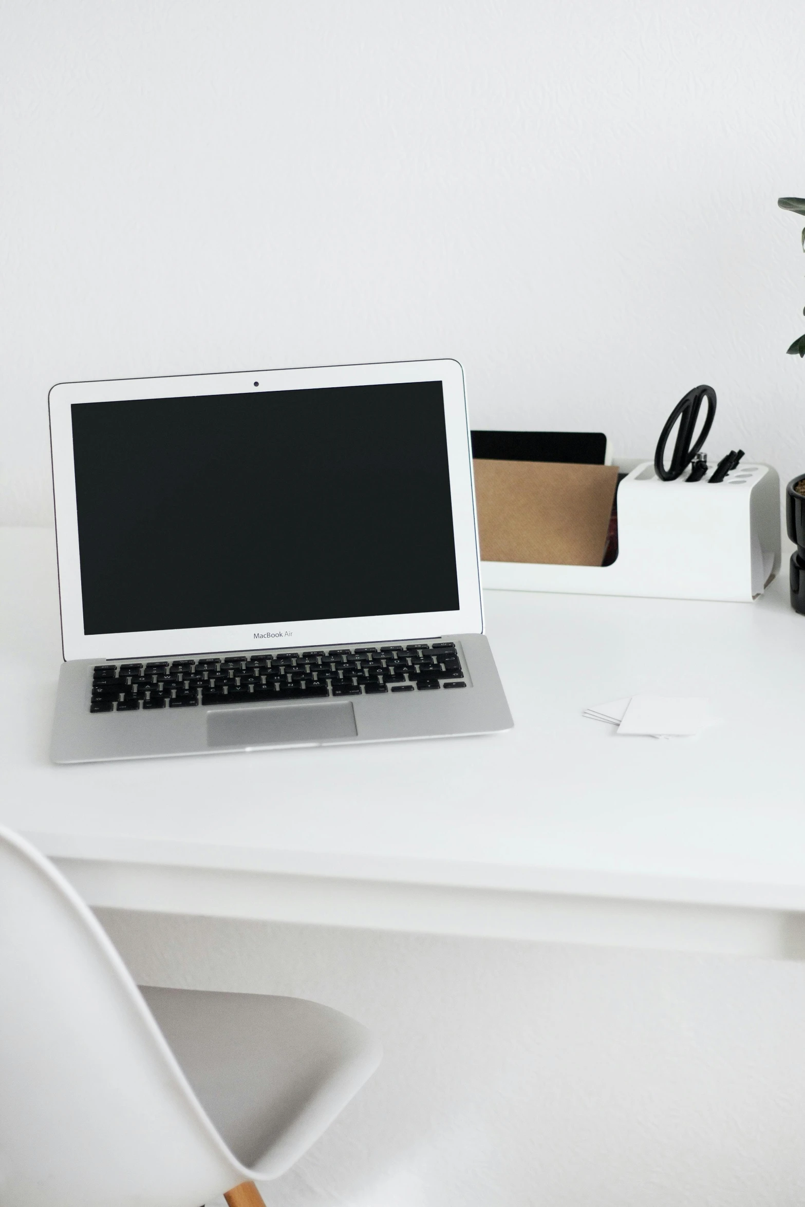 a laptop computer sitting on top of a white desk, by Robbie Trevino, trending on unsplash, dwell, curated collections, maintenance photo, white