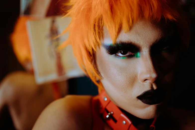 a close up of a person with orange hair, an album cover, trending on pexels, lowbrow, unreal engine : : rave makeup, punk party, androgyny, harley queen