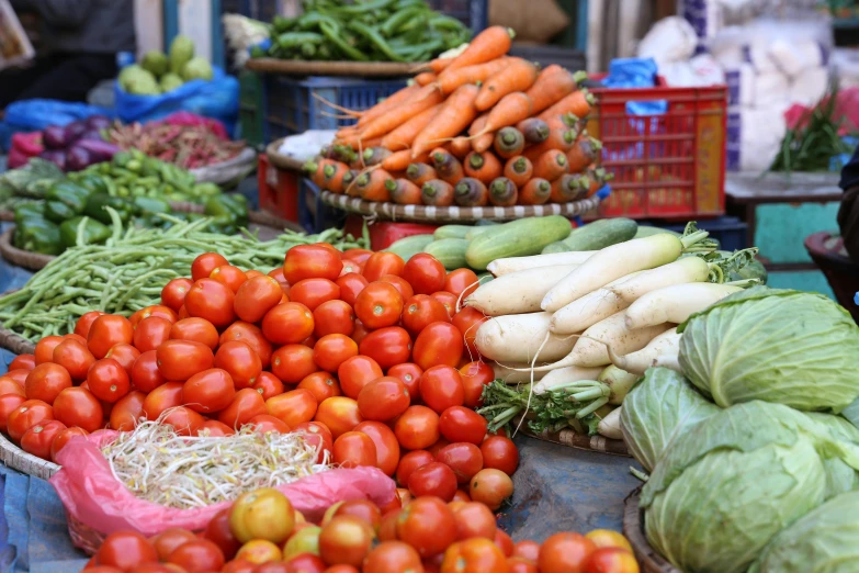 a table topped with lots of different types of vegetables, vietnam, profile image