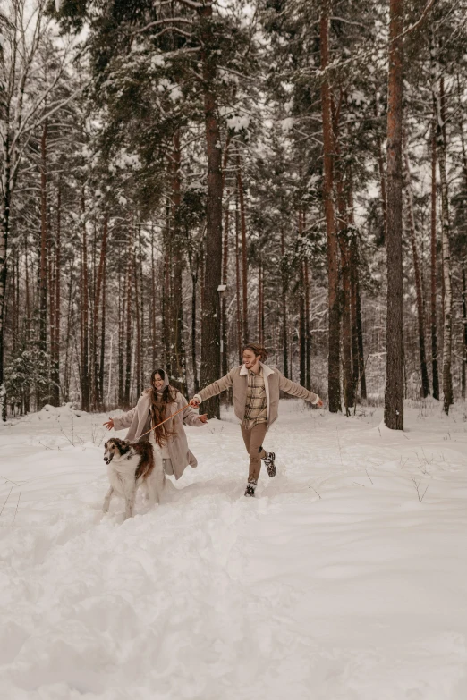 a man and a woman running in the snow, by Grytė Pintukaitė, pexels contest winner, romanticism, forest style studio shot, gif, brown, russia