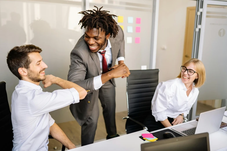 a group of people sitting around a table in an office, people dancing, highly upvoted, multiple stories, lachlan bailey