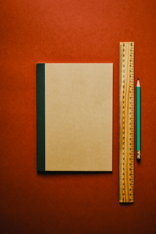 a notebook, pencil and ruler on a red background, an album cover, by Paul Bird, unsplash, brown paper, large tall, tall thin build, thumbnail