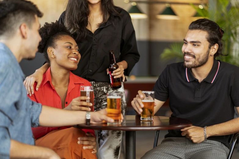 a group of people sitting around a table with drinks, profile image, digital image