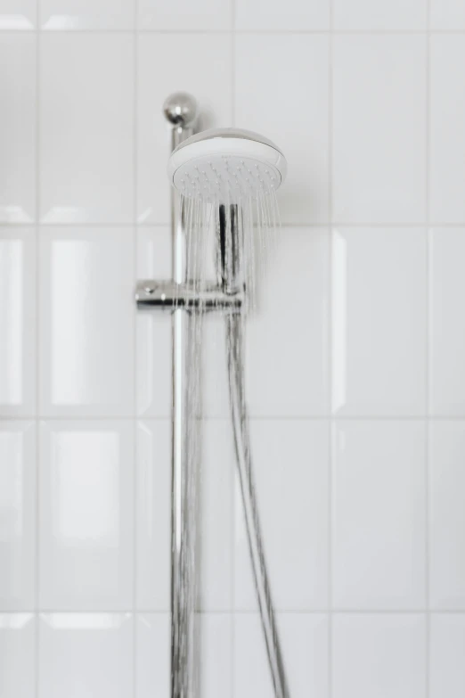 a shower head in a white tiled bathroom, pexels, espoo, ilustration, made of glazed, tall