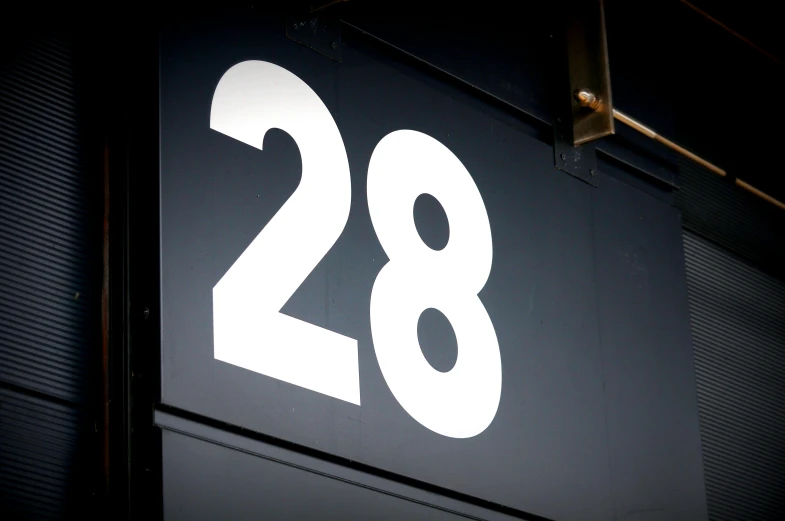 a close up of a sign with the number 28 on it, by David Simpson, international typographic style, profile image, square, entrance, f18