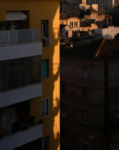 a tall building with a clock on top of it, by Alexis Grimou, unsplash contest winner, sun and shadow over a city, young handsome pale roma, neighborhood outside window, shadow gradient