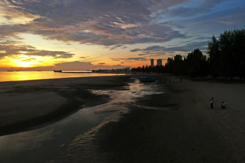 a man flying a kite on top of a sandy beach, a picture, by Chris Rallis, unsplash, hurufiyya, sunset panorama, vancouver, photo taken with an iphone, sangyeob park