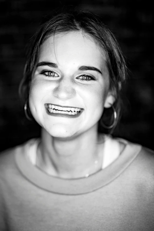 a black and white photo of a smiling girl, a black and white photo, by Jacob Toorenvliet, hyperrealistic teen, underbite, fun smile, joey king