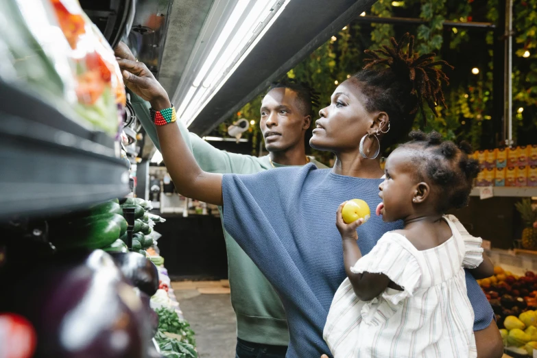 a couple of people standing in front of a produce stand, a digital rendering, pexels contest winner, happening, wakanda, husband wife and son, look at the details, dark-skinned