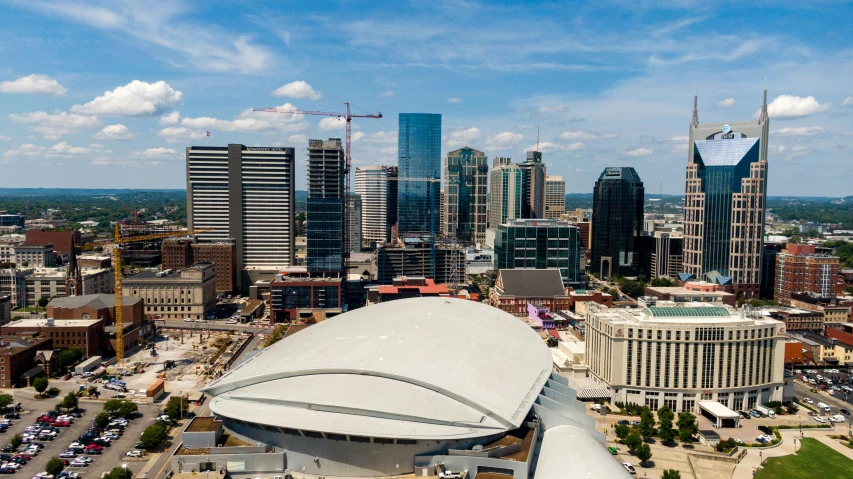 an aerial view of a city with tall buildings, by Dan Frazier, pexels contest winner, hurufiyya, tn, alan jackson, 3 / 4 wide shot, cool skydome