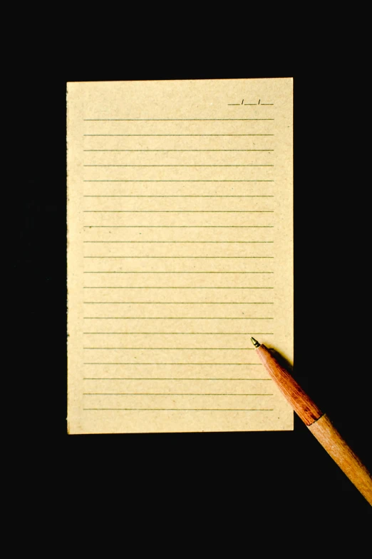 a pencil sitting on top of a piece of paper, in front of a black background, lined paper, thumbnail, an antique