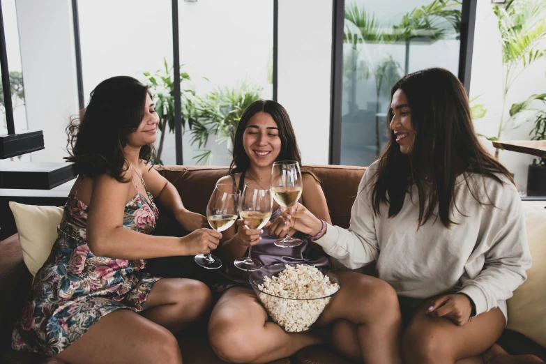 three women sitting on a couch drinking wine and popcorn, pexels contest winner, an olive skinned, slightly erotic, profile image, vines