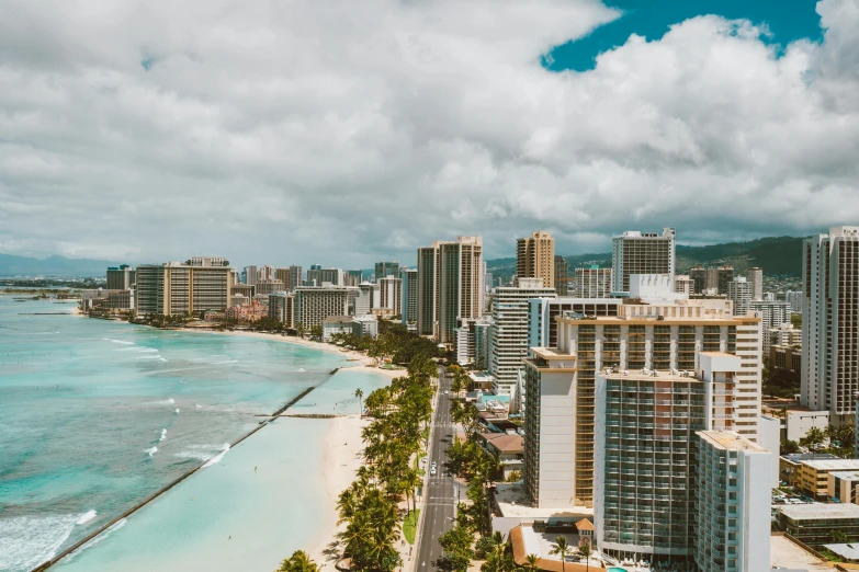 a large body of water surrounded by tall buildings, pexels contest winner, hurufiyya, hawaii beach, slide show, high resolution, multiple stories