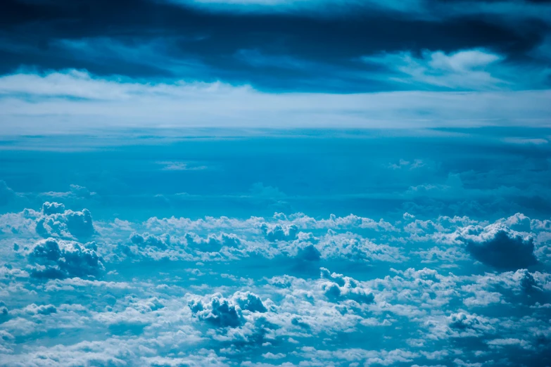 a blue sky filled with lots of clouds, by Niko Henrichon, pexels contest winner, surrealism, birdseye view, visible sky and humid atmosphere, dramatic ”