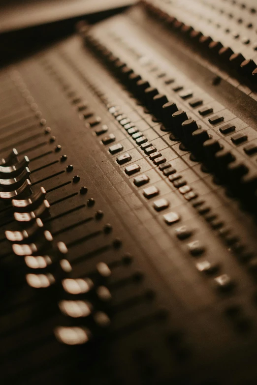 a black and white photo of a sound board, an album cover, inspired by Pierre Soulages, unsplash, brown, intricate machinery, colour photograph, zippers