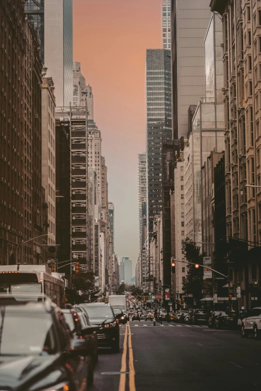 a city street filled with lots of tall buildings, a picture, pexels contest winner, modernism, manhattan, background image, evening time, high resolution photo