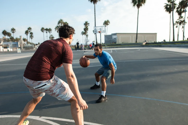 two men playing basketball on a basketball court, oceanside, nathan for you, profile image