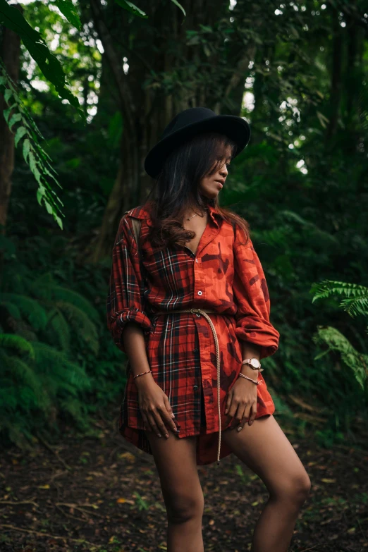 a woman standing in the middle of a forest, an album cover, pexels contest winner, sumatraism, wearing a red plaid dress, tropical mood, street wear, ( ( ( kauai ) ) )