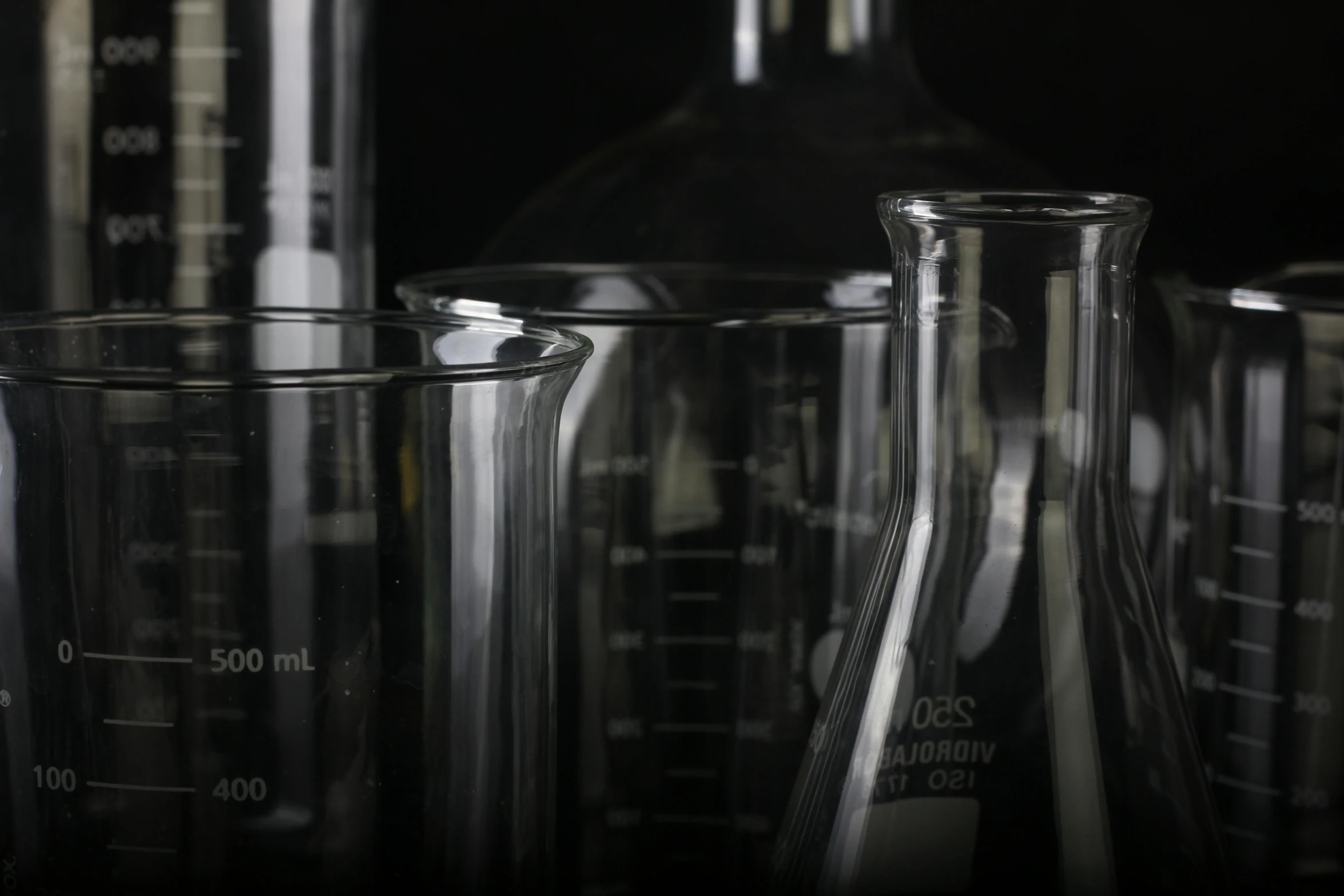 a group of glassware sitting on top of a table, analytical art, experimenting in her science lab, up-close, detailed product image, shot on sony a 7