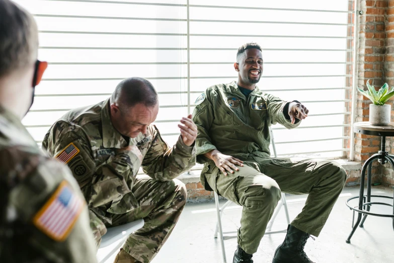 a group of military men sitting next to each other, by Nina Hamnett, pexels, chris rock slapping will smith, military pilot clothing, profile image, instagram post