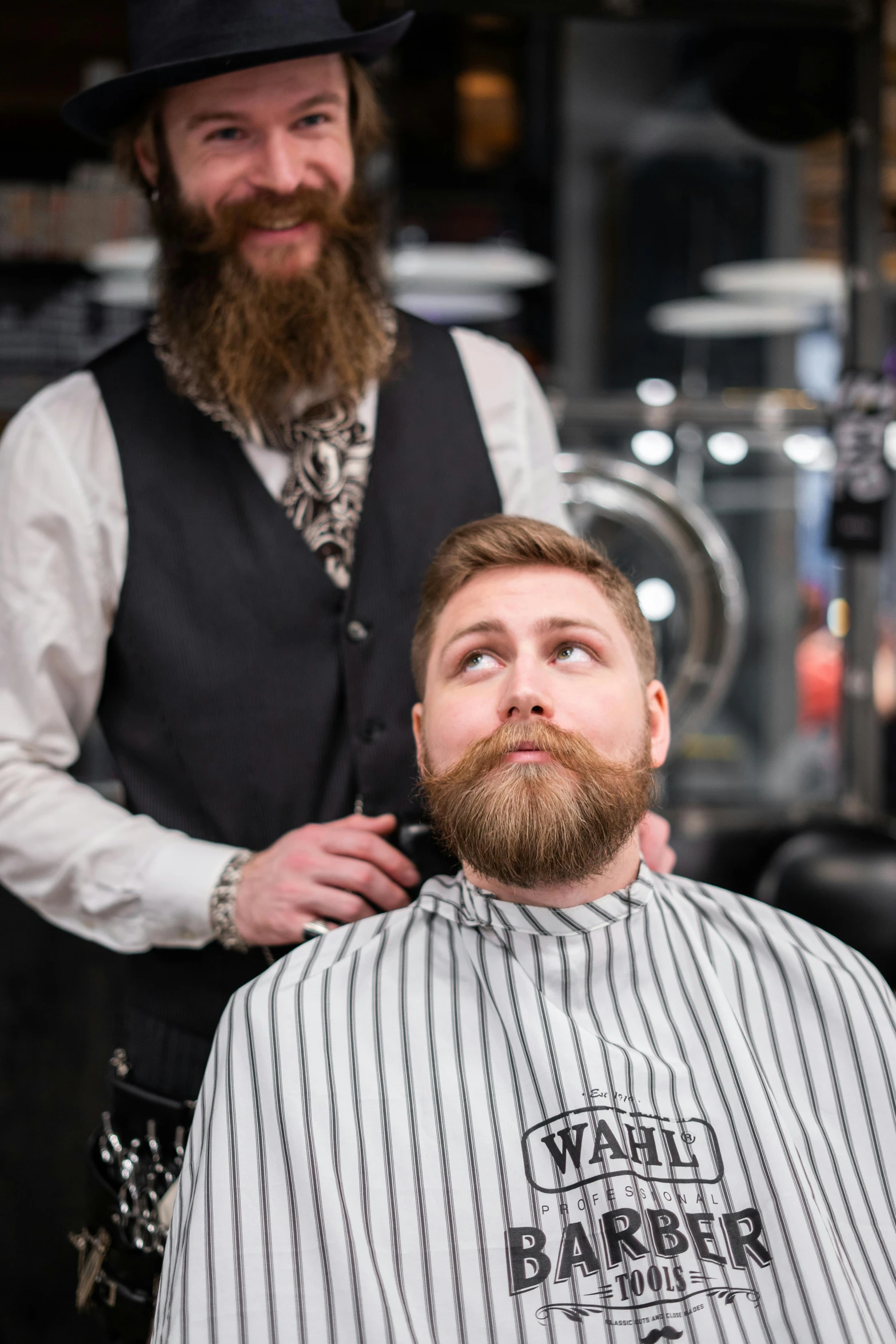 a man getting a haircut at a barber shop, inspired by James Baynes, silver full beard, felix englund, looking off to the side, reddish beard